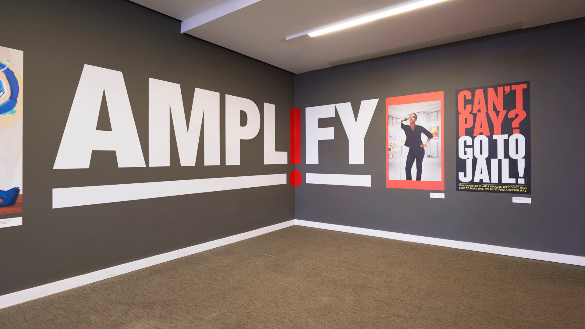 interior of a grey room with the AMPL!FY logo in the corner